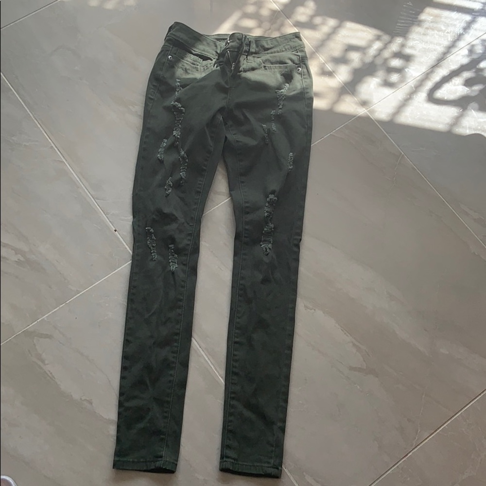 Green ripped jeans.